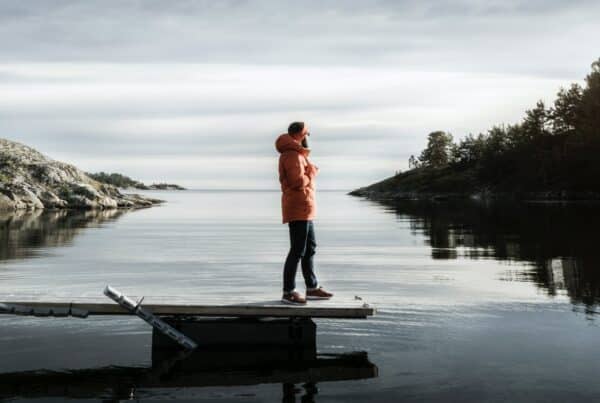person standing on bridge