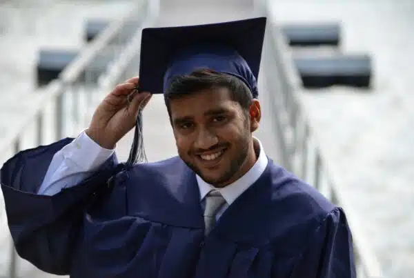 man holding his graduation cap