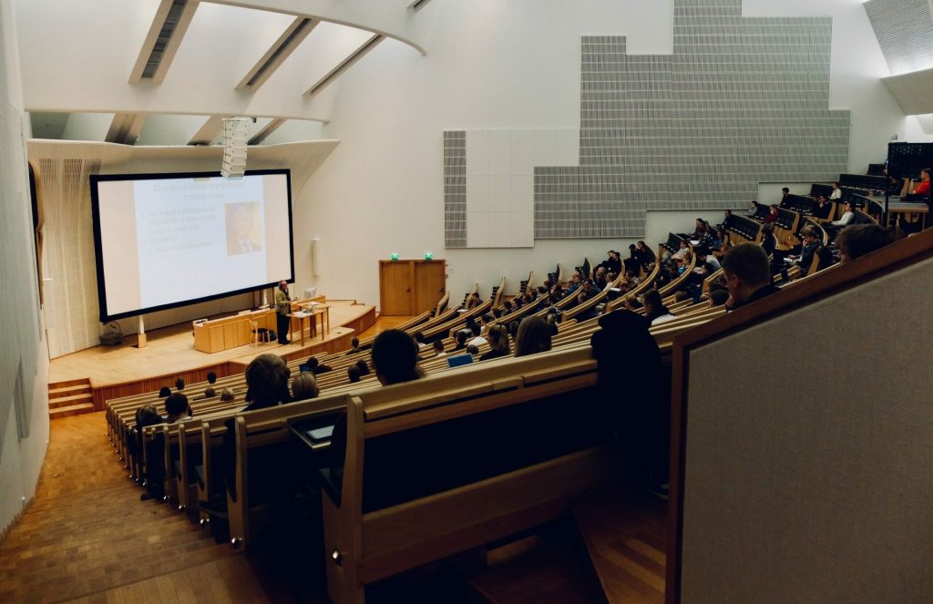 people sitting on chair in front of computer