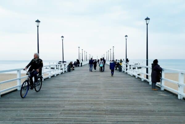 people walking on pier during daytime